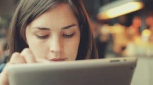 stock-footage-woman-using-tablet-computer-touchscreen-in-cafe-x